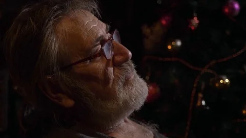 Close-up profile portrait of tired senior man takes off his glasses at dark room Stock Footage 80362555