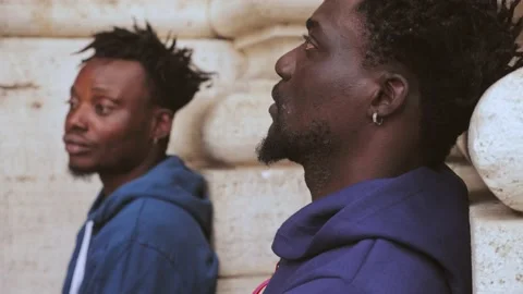 Close up profile on sad desperate two african migrants: despair and fear concept Stock Footage 218617102
