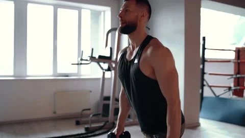 The close, the profile of young muscular executing lunges in a gym. Healthy Stock Footage 156507632