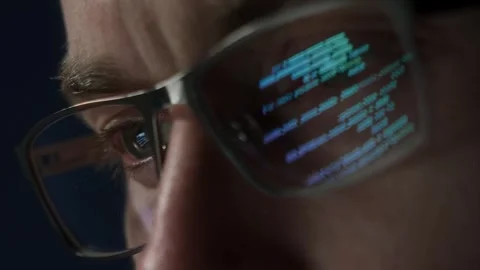Close-up of programmer with code reflection in glasses Stock Footage 308016180