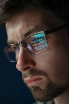 Close-up of programmer with code reflection in glasses Stock Photos