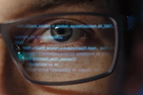 Close-up of programmer with code reflection Stockfoto's