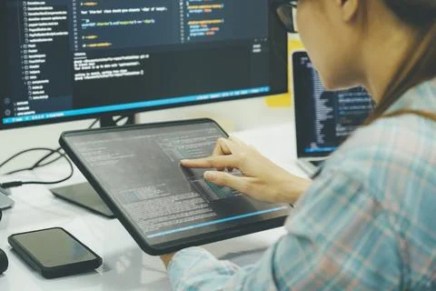 Close up programmer is coding and programming software. 库存照片