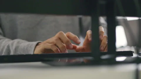 Close-Up of Programmer Coding Late at Night in Modern Office. Stock Footage 310589228