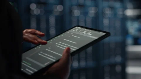 Close up of programmer in data center using tablet Stock Footage 317126836