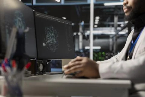 Close up of programmer in data center using AI powered tech to run simulations Stock Photos