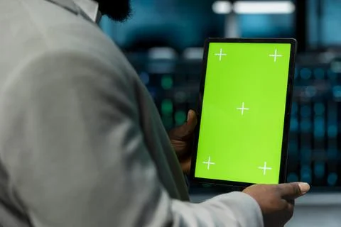 Close up of programmer in data center using isolated screen tablet 스톡 사진
