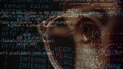 Close-Up of Programmer Eye Behind Glasses With Code Reflection Видео 336013274