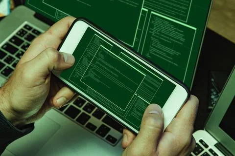 Close up of programmer of hacker hands typing a code Stock Photos