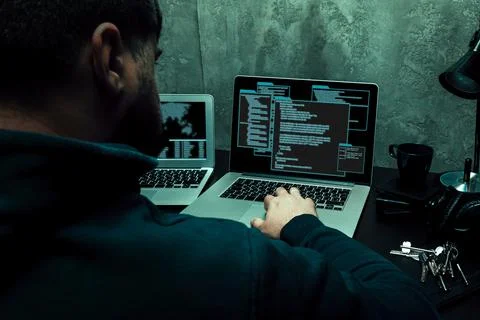 Close up of programmer of hacker hands typing a code Stock Photos