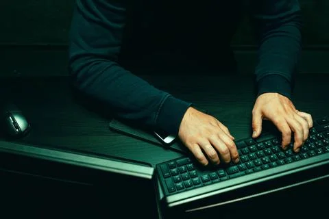 Close up of programmer of hacker hands typing a code Stock Photos