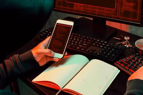 Close up of programmer of hacker hands typing a code Stock Photos