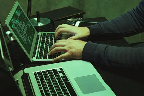 Close up of programmer of hacker hands typing a code Stock Photos