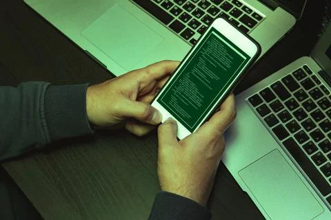 Close up of programmer of hacker hands typing a code Stock Photos