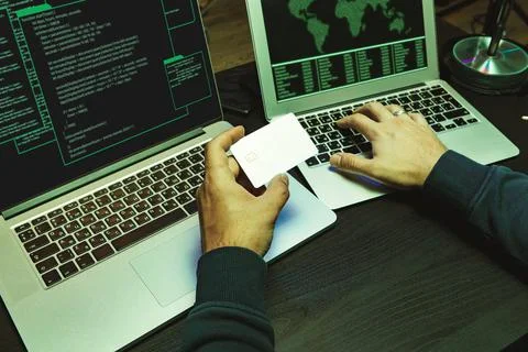 Close up of programmer of hacker hands typing a code Stock Photos