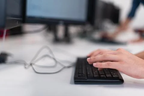 Close up programmer man hand typing on keyboard at desktop pc to input code Stock Photos