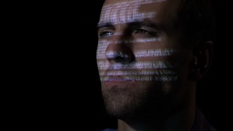Close up of a programmer software developer working in a dark room while the  Stock Footage 86434784