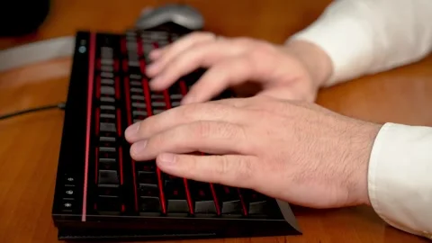 Close up Programmer typing code quickly on computer keyboard. Software developer Stock Footage 303497162