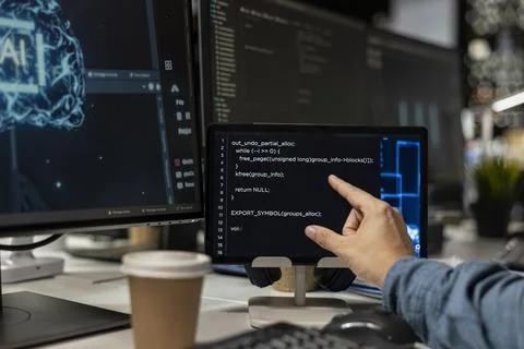 Close up of programmer using tablet in office, reviewing AI system metrics Stock-Fotos