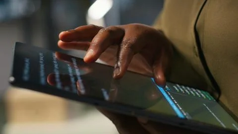 Close up of programmer utilizing AI on tablet to optimize performance Stock Photos