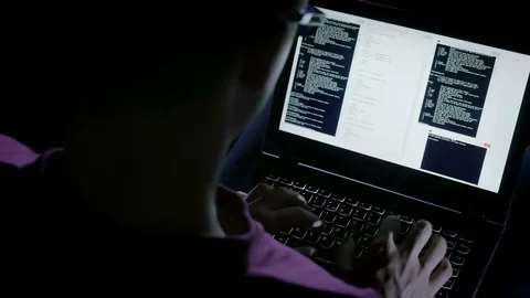 Close-up of programmer working with codes in a dark room Stock Footage 72543139