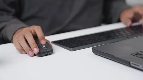 Close-Up of a Programmer Working with a Mouse and Keyboard in a Digital Env.. Stock-Footage 336680237