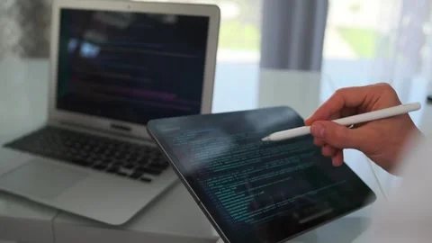 Close up of programmers debugging code on a laptop. Stock Footage 294298614
