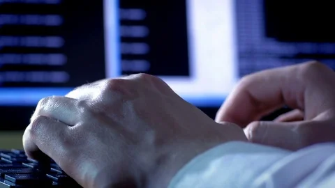 Close-up of programmer's hands typing commands 動画素材 72467954