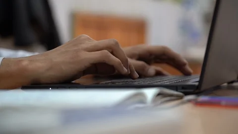 Close-up of programmer's hands typing commands. Young man using the keyboard Stock Footage 107864323