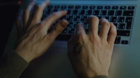 Close-up of programmer's hands typing commands. Stock. Hands typing on keyboard Stock Photos