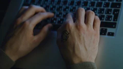 Close-up of programmer's hands typing commands. Stock. Hands typing on keyboard Stock Photos