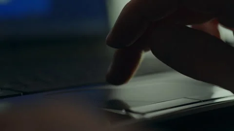 Close-up of a programmer's hands working on a portable laptop in the dark. S Stock Footage 255682942