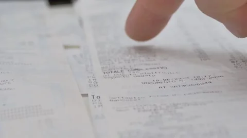 Close-up, proofreading paper check, many different checks Video stock 254804641