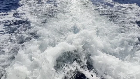 Close up propeller wash white foam churning sea water Stock Footage 345962517