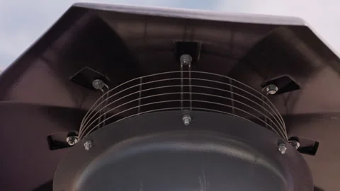 Close up of protective rain cap on rooftop ventilation exhaust unit Vidéo 347205786