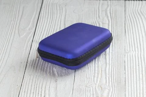 Close up of protective small hard case on wooden background Stock Photos