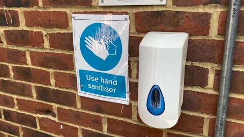 Close Up of public hand sanitiser on wall Stock Footage 153109749
