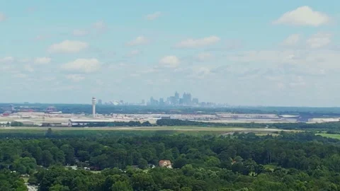 Close up pull away from a major airport with city in the background Stock Footage 170841556
