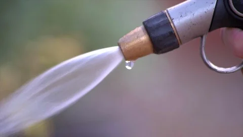 Close Up Pull Focus of a Hose Turning Off Stock Footage 93255690