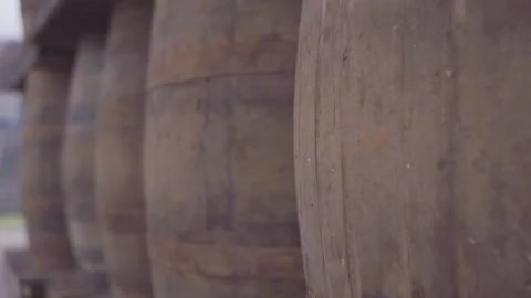 Close up of pull focus of whiskey barrels Stock Footage 251468056