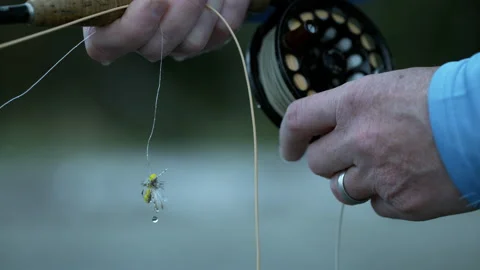 Close up of pulling out fishing line from reel in super slow motion Stock Footage 146368848