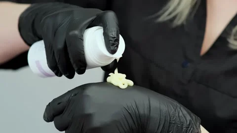 Close-up of pulse oximeter tracking on a patient's finger during surgery Stockbeeldmateriaal 263974173