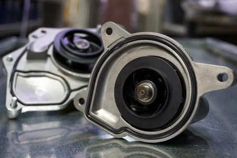 Close-up - pump of the cooling system of a modern car. Stock Photos