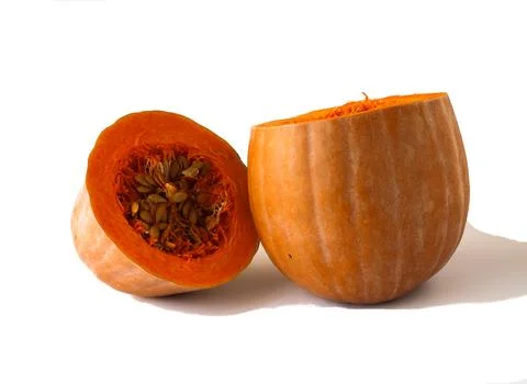 Close-up of a pumpkin, cut in two crosswise, on a white background. Foto stock