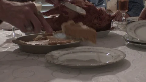 Close as pumpkin pie is cut and placed on plate for serving, 4K. Stock Footage 81644654