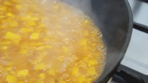 Close up of pumpkin risotto bubbling and reducing Stockbeeldmateriaal 151970417