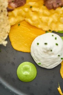 Close-up Pumpkin Risotto with with duck and parmesan cheese mousse. Seasonal Stock Photos