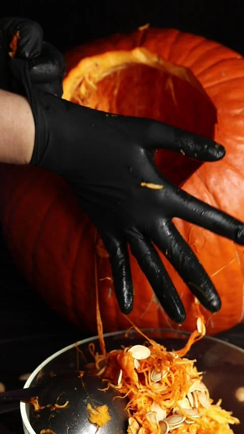 Close-up of pumpkin seeding for Halloween 스톡 동영상 348390159