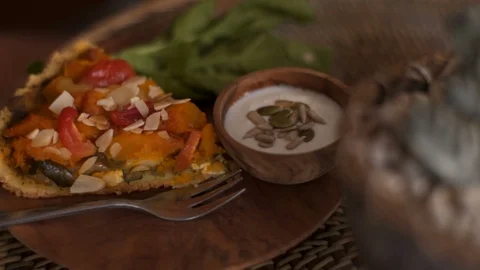 Close up Pumpkin vegetable pie with vegan sauce on a rustic plate Stock Footage 101647591