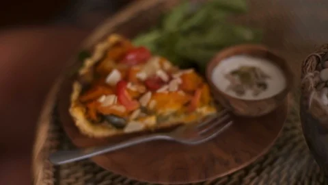Close up Pumpkin vegetable pie with vegan sauce on a rustic plate. Video stock 101648760